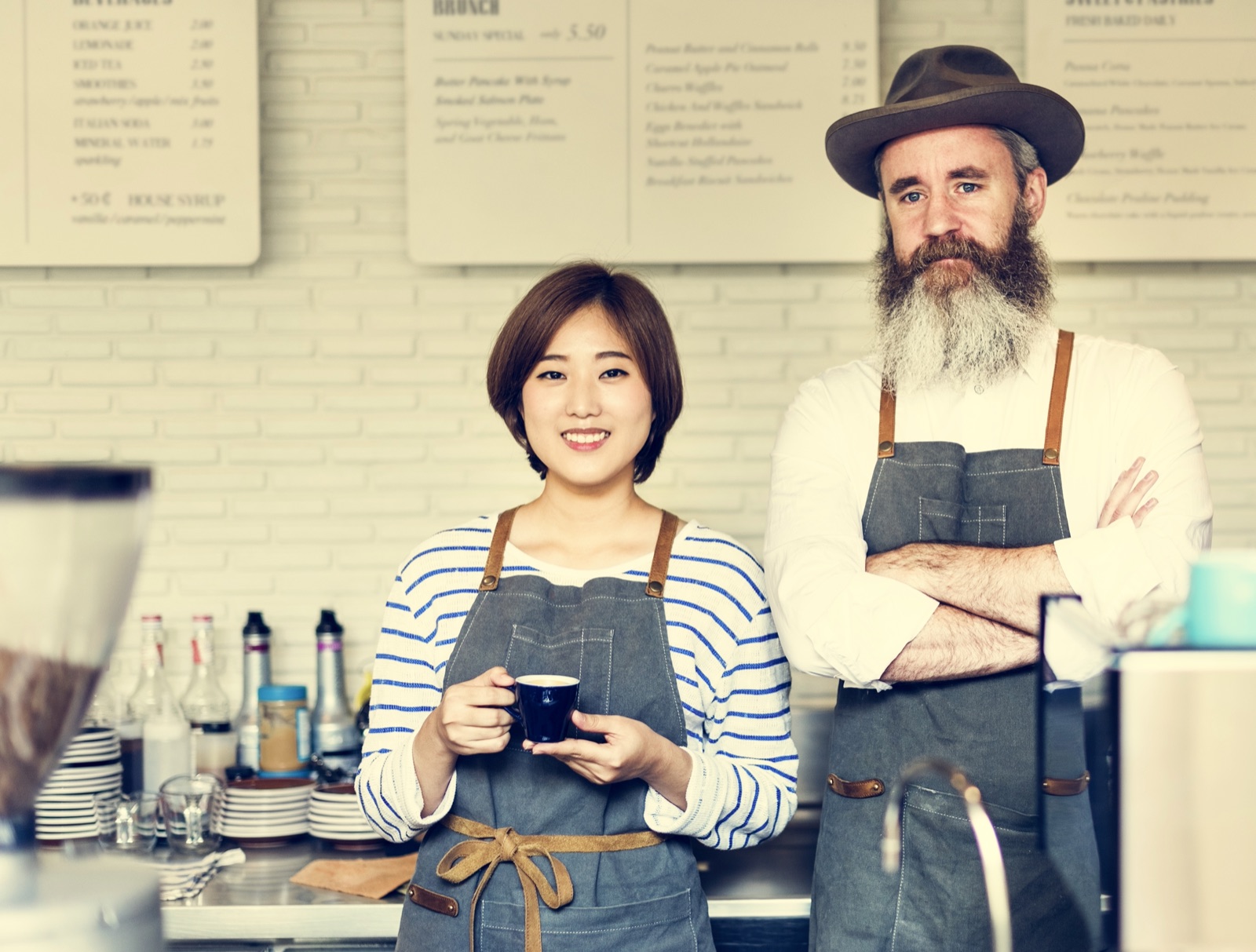 Two cafe owners behind the counter